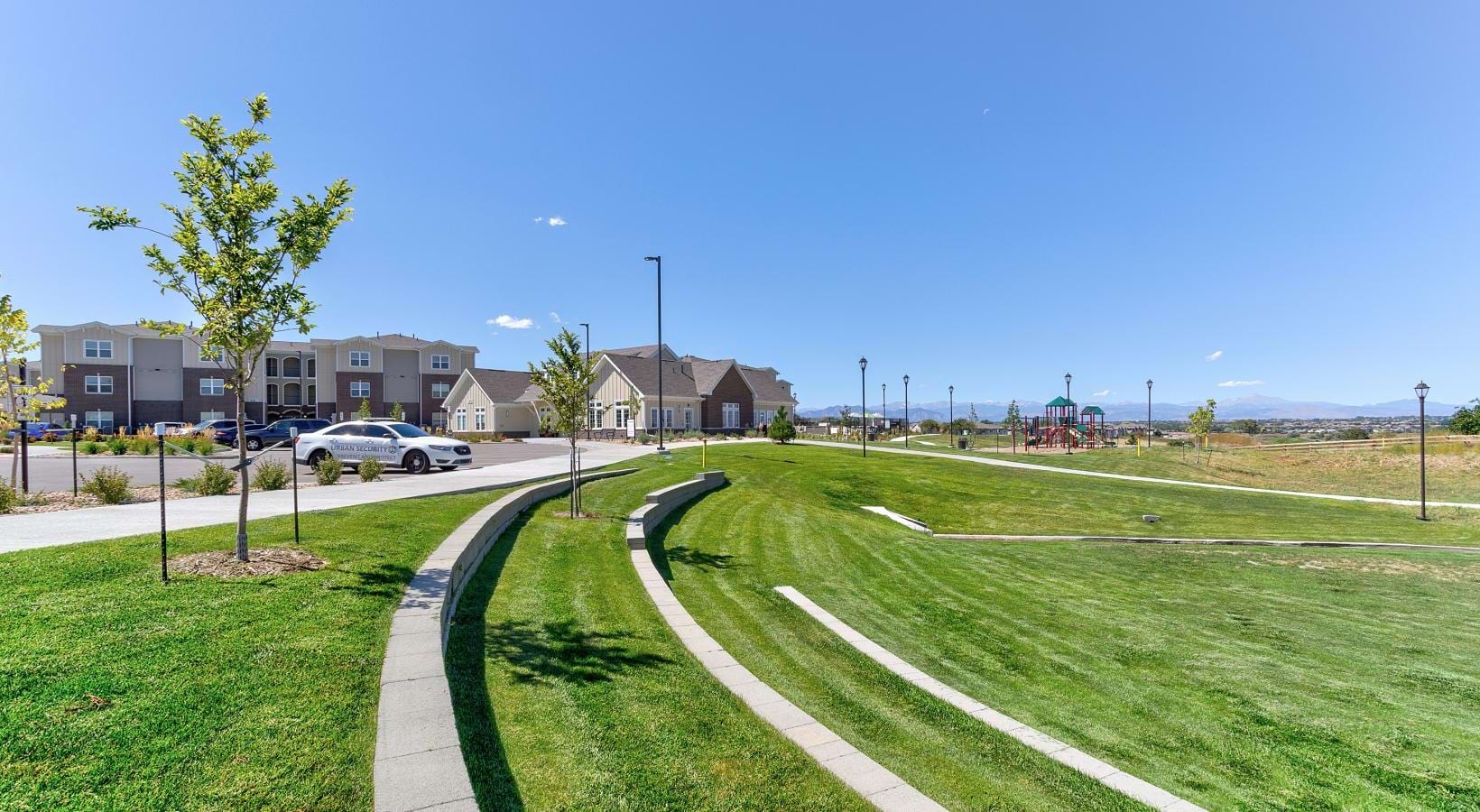 A beautiful community at the heart of all your passions a road with grass and trees