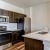 a kitchen with brown cabinets