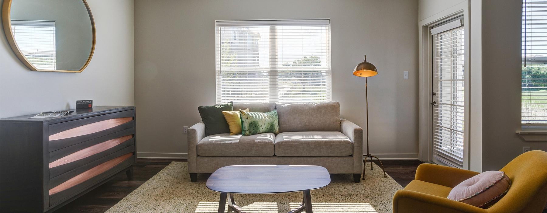 a living room with a couch and a table