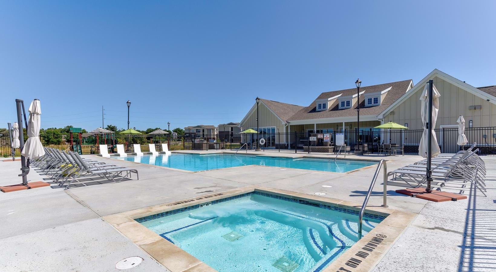 Shimmering resort-style pool a swimming pool in a backyard