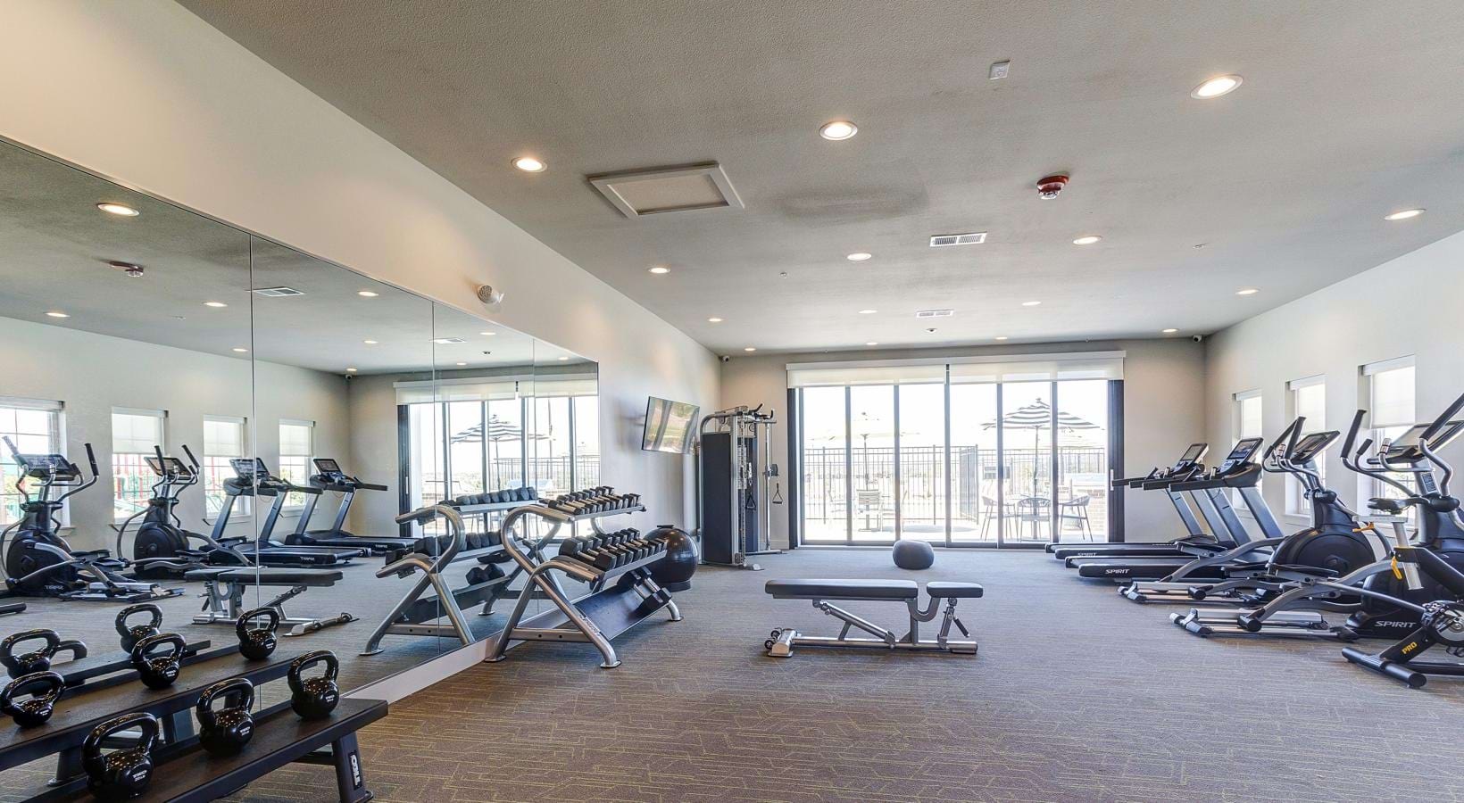 Get your workout on a room with exercise equipment